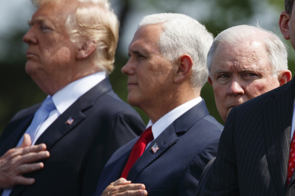 President Donald Trump, Vice President Mike Pence, and Attorney General Jeff Sessions stand for the national anthem during the 37th annual National Peace Officers Memorial Service on Capitol Hill, Tuesday, May 15, 2018, in Washington. (AP Photo/Evan Vucci)