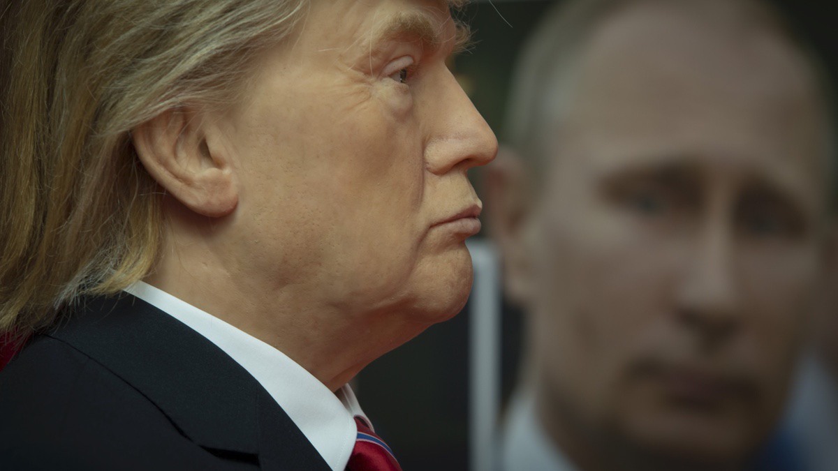 Wax model of US President Donald Trump, left, stands near to a portrait of Russian President Vladimir Putin, displayed in the wax museum in Sofia, Friday March 31, 2017. (AP Photo/Valentina Petrova)