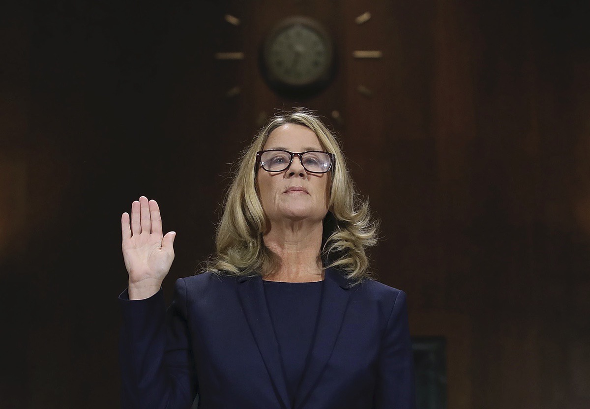Christine Blasey Ford is sworn in before the Senate Judiciary Committee, Thursday, Sept. 27, 2018 in Washington. Her attorney's Debra Katz and Michael Bromwich watch. (Win McNamee/Pool Image via AP)