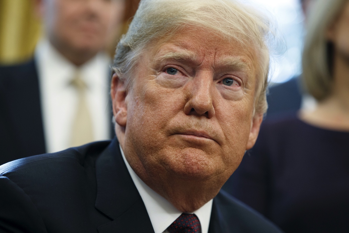 President Donald Trump listens to a question during a signing ceremony of the "Cybersecurity and Infrastructure Security Agency Act," in the Oval Office of the White House, Friday, Nov. 16, 2018, in Washington. (AP Photo/Evan Vucci)