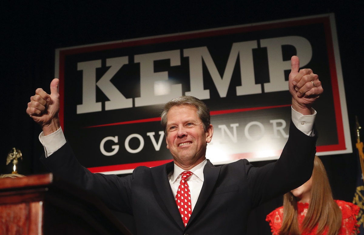 Georgia Republican gubernatorial candidate Brian Kemp gives a thumbs-up to supporters, Wednesday, Nov. 7, 2018, in Athens, Ga. (AP Photo/John Bazemore)